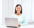 International student girl with laptop at school