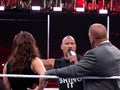 International superstar the Rock, Dwayne Johnson stands in the ring and talks into mic