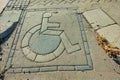 An international symbol indicating the possibility of passage of wheelchairs on the city street. Accessibility of visits