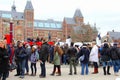 Tourists buy tickets at the Rijksmuseum, Amsterdam, Netherlands