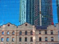 Skyscraper Tower Reflected in Glass Building Facade