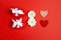 International Women`s Day card with gifts, hearts and chrysanthemum flowers in the form of eight on red background