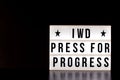 International Women`s Day - concept - `Press for Progress` 2018 theme - light box with cinema style lettering on black background