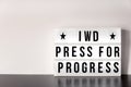 International Women`s Day - concept - `Press for Progress` 2018 theme - light box with cinema style lettering on white background