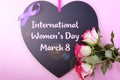 International Women`s Day Notice Board Greeting with lens flare. Royalty Free Stock Photo