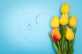 International Womens Day with flowers and heart shape necklace on blue background Royalty Free Stock Photo