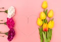 International Womens Day with flowers and heart shape necklace on pink background Royalty Free Stock Photo
