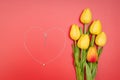 International Womens Day with flowers and heart shape necklace on red background Royalty Free Stock Photo