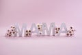 International word mama made from white wooden letters. Greeting card for Happy mother day.