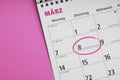 Internationaler Frauentag or international women's day on March 8 is circled in german calendar Royalty Free Stock Photo