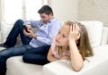 Internet addict father using mobile phone ignoring little sad daughter bored lonely and depressed Royalty Free Stock Photo