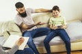 Internet addicted boy visiting therapist with his father Royalty Free Stock Photo