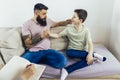 Internet addicted boy visiting therapist with his father Royalty Free Stock Photo