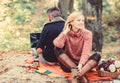 Internet addicted husband. Working on fresh air. Surfing internet. Happy loving couple relaxing in park with laptop Royalty Free Stock Photo