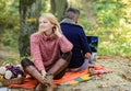 Internet addicted husband. Working on fresh air. Surfing internet. Happy loving couple relaxing in park with laptop Royalty Free Stock Photo