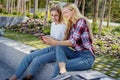 Two adult student girl spending time near campus Royalty Free Stock Photo