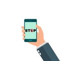 Internet addiction, nomophobia and digital detox. Hand holding smartphone. Stop sign on screen telephone mobile