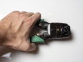 Internet cable crimping tool in male hand close up Royalty Free Stock Photo