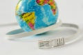 Internet cable with earth planet on white background - Concept of global internet connection Royalty Free Stock Photo