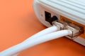 The Internet cable plugs are connected to the Internet router, w Royalty Free Stock Photo