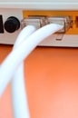 The Internet cable plugs are connected to the Internet router, w Royalty Free Stock Photo