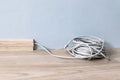 Internet cable RJ 45 in the baseboard along the gray wall in the room Royalty Free Stock Photo