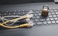 Internet cables with a padlock on the laptop Royalty Free Stock Photo