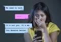 Internet chat composite with young Asian Korean woman desperate suffering pain dumped by his boyfriend via mobile phone receiving Royalty Free Stock Photo