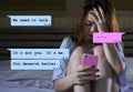 Internet chat composite with young woman desperate in bed suffering pain dumped by his boyfriend via mobile phone receiving Royalty Free Stock Photo