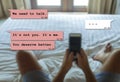 Internet chat composite with young man in bed dumped by his girfriend via mobile phone receiving painful text and break up Royalty Free Stock Photo