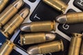 Internet dangers concept. Close up of bullets and laptop keyboard Royalty Free Stock Photo