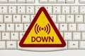 Internet Down message on a sign on a computer keyboard