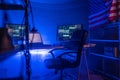 Internet hacker workplace in dark office, cyberwar concept.