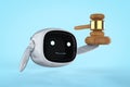 Internet law concept with small and cute robot hold gavel judge