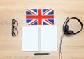 Internet learning of English. Top view of headphones and flag of Great Britain.