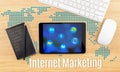 Internet Marketing word with tablet,keyboard and black notebook Royalty Free Stock Photo