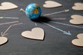 Internet or online dating and love. Global communication, networking and sharing concept. Globe and figures of hearts Royalty Free Stock Photo