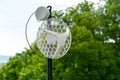 Internet outdoor wireless antenna metal rod on the roof and green tree and sky in the background Royalty Free Stock Photo