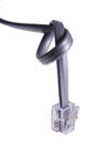 Internet phone cable with knot Royalty Free Stock Photo