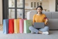 Internet Purchases. Indian Woman Using Laptop And Credit Card For Online Shopping Royalty Free Stock Photo