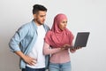 Internet Scams. Confused Young Muslim Couple Looking At Laptop Screen With Worry Royalty Free Stock Photo