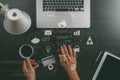 Internet shopping concept.Top view of hands working with calculator and laptop and credit card and tablet computer on dark wooden Royalty Free Stock Photo