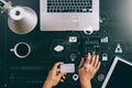 Internet shopping concept.Top view of hands working with calculator and laptop and credit card and tablet computer on dark wooden Royalty Free Stock Photo