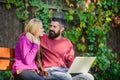 Internet surfing concept. Couple in love notebook consume content. Surfing internet together. Couple with laptop sit Royalty Free Stock Photo