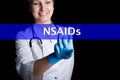 Internet and technology concept. smiling female doctor presses a finger on a virtual screen. NSAIDs written on a virtual Royalty Free Stock Photo