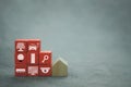 Internet of things, IOT, smart home concept. A smart home control system icons on wood red block with wood home Royalty Free Stock Photo