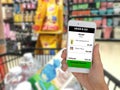 Internet of things marketting concepts,customer use application in mobile phone to buy a product in retail by grab and go,no check Royalty Free Stock Photo