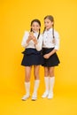 Internet is wonderful resource but access to it has hazards for kids. Girls school uniform using smartphone. Schoolgirls