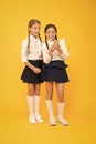 Internet is wonderful resource but access to it has hazards for kids. Girls school uniform using smartphone. Schoolgirls