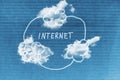 Internet written on blue cloudy background Royalty Free Stock Photo